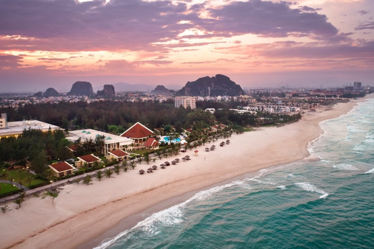 Scenic view of Non Nuoc Beach and Marble Mountains at sunrise